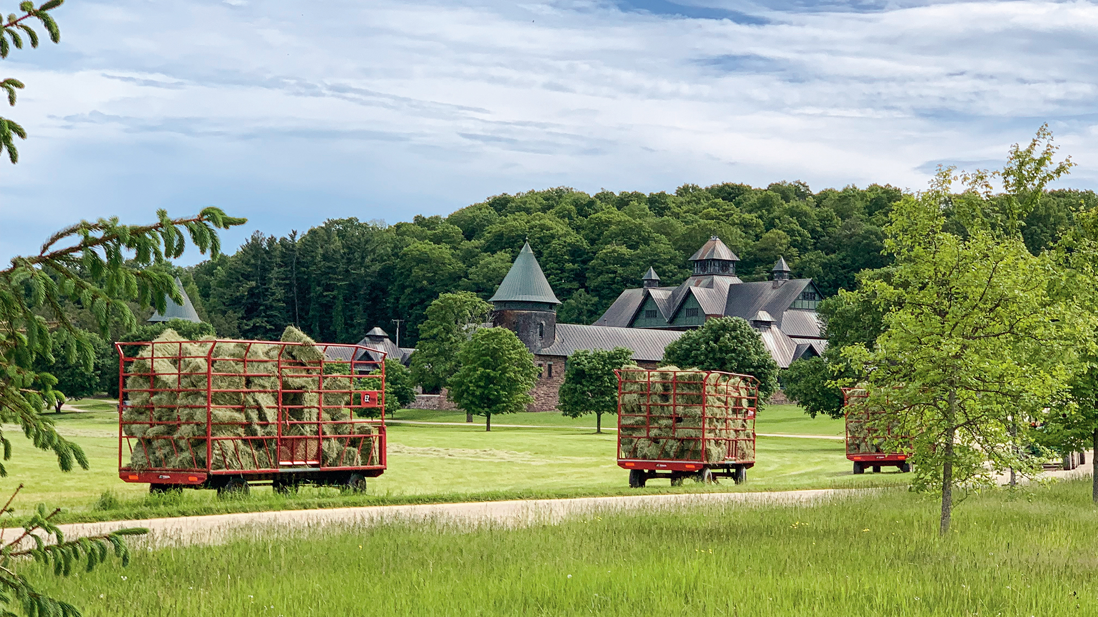 Farm Barn with Hay Wagons in foreground