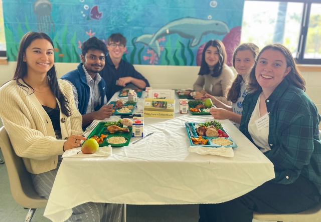 Students enjoy a school meal incorporating healthy, local products, in their cafeteria in Duxbury, VT.